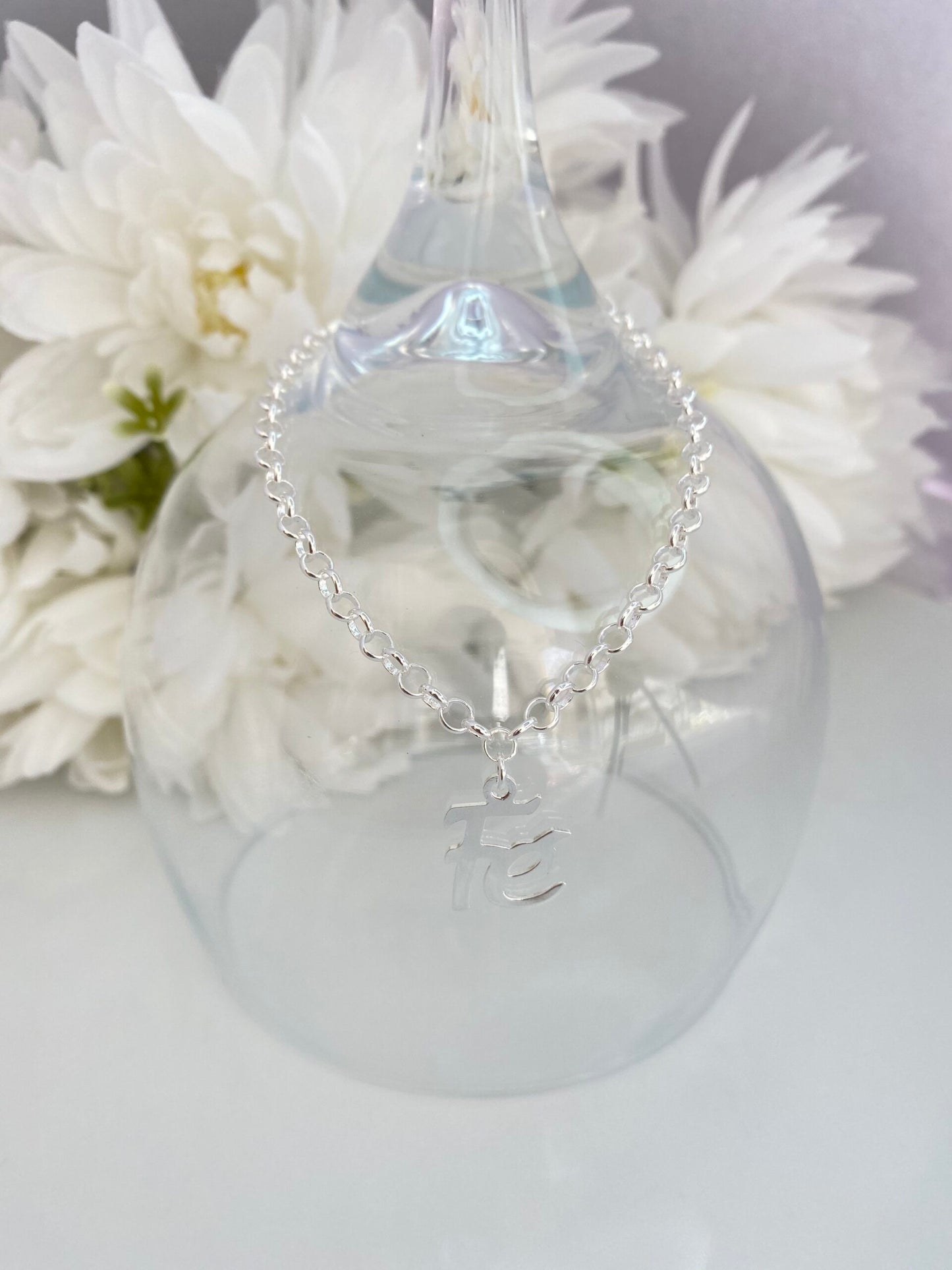 PULSEIRA PRATA COM PINGENTE FÉ